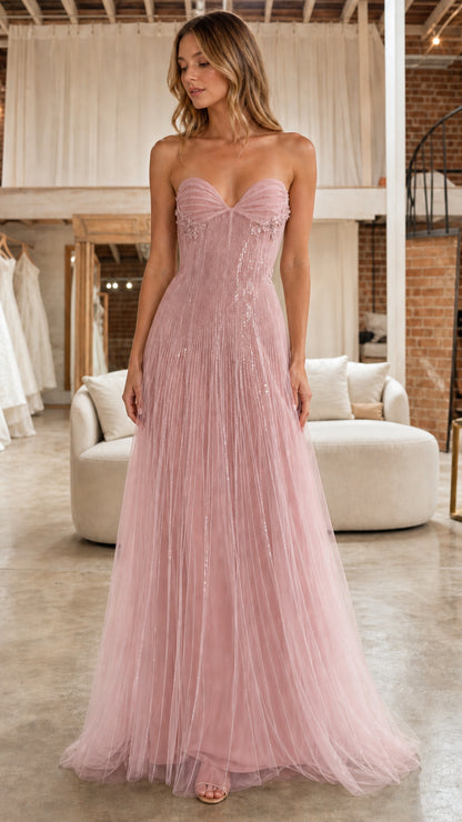 Front full view of model in the dusty pink strapless beaded tulle formal dress