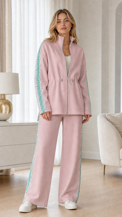 Full-length view of woman wearing blush pink two-piece tracksuit set