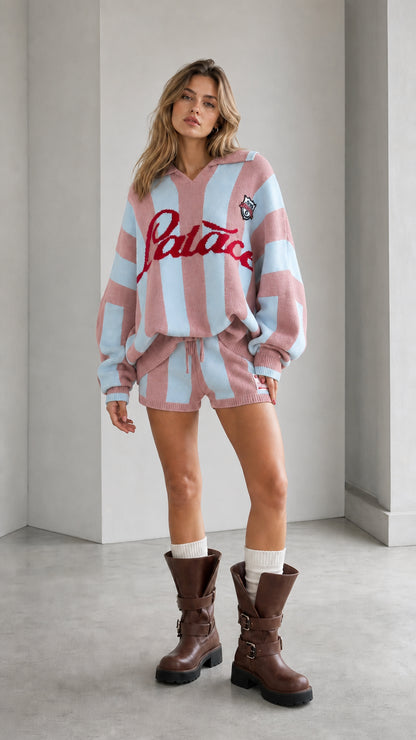 Model wearing pastel pink and light blue striped knit sweater and shorts set