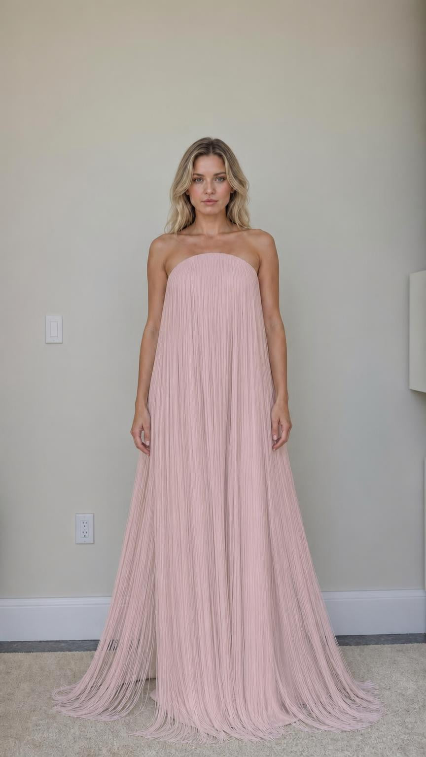 Front view of pink strapless fringe maxi dress