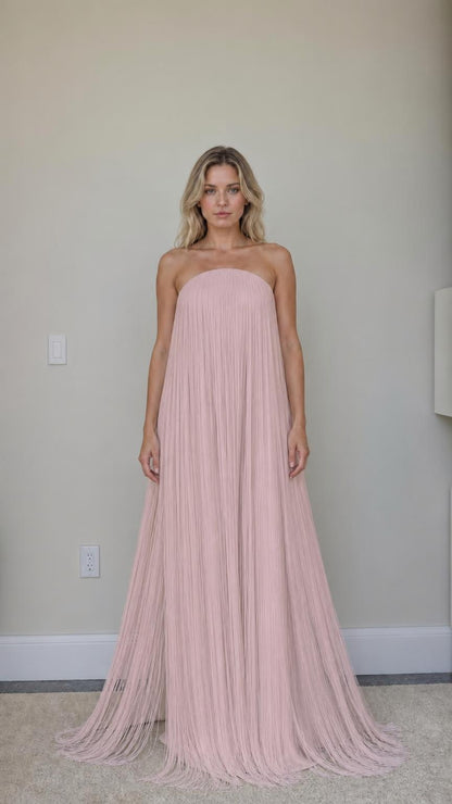 Front view of pink strapless fringe maxi dress
