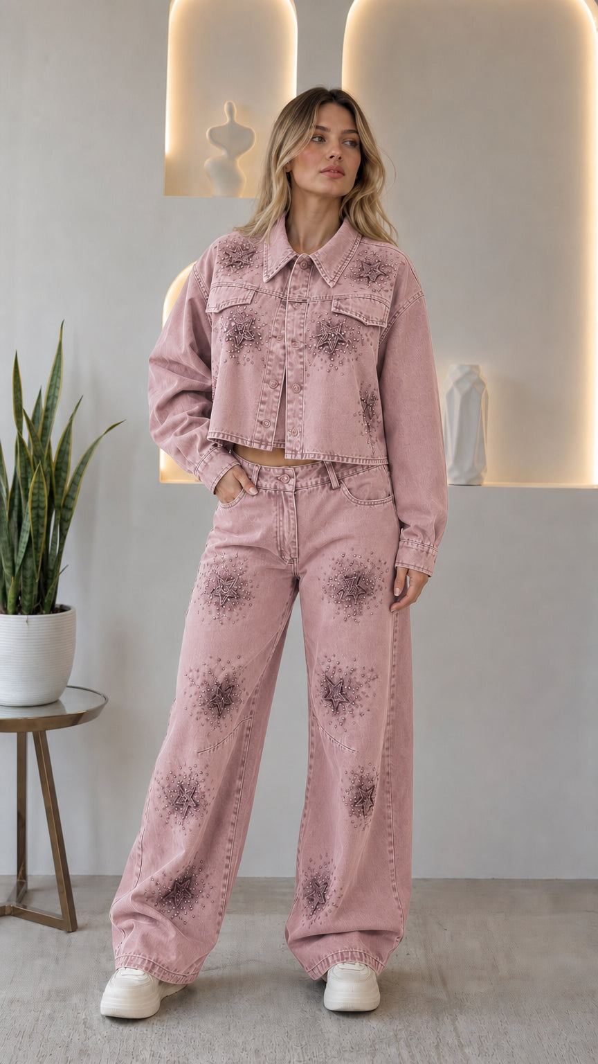 Woman wearing dusty pink rhinestone star cropped denim jacket and wide leg jeans two-piece set