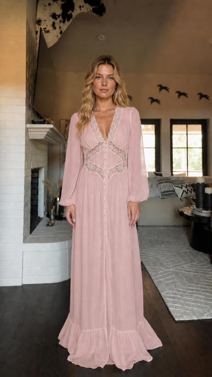 Front view of woman wearing pink long sleeve maxi dress