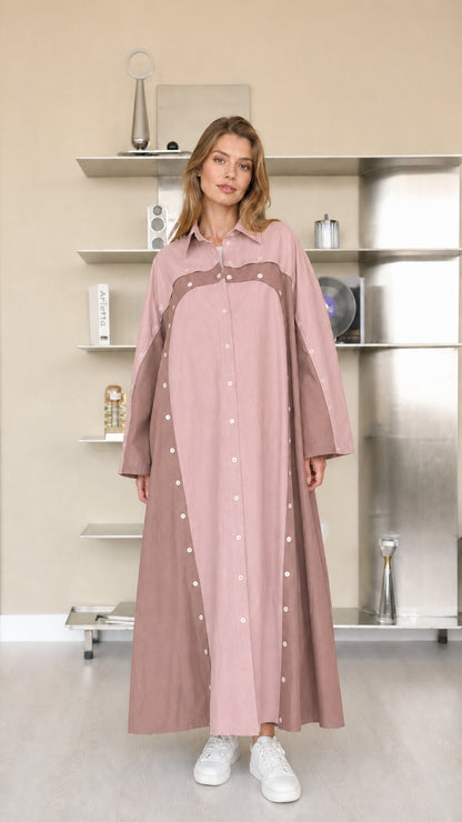 Front view of woman wearing dusty pink two-tone maxi shirt dress