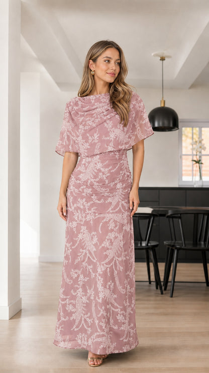 Front view of woman wearing Dusty Rose floral textured capelet maxi dress