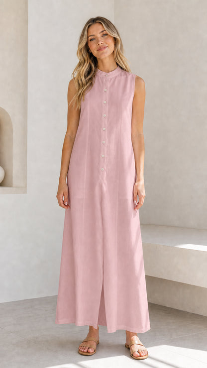 Full view of a woman wearing a pink sleeveless button-down maxi dress