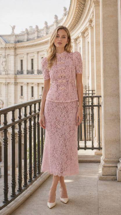 Model wearing blush pink floral lace two-piece midi set on balcony