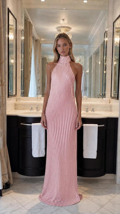 Front view of model wearing pink striped halter maxi dress