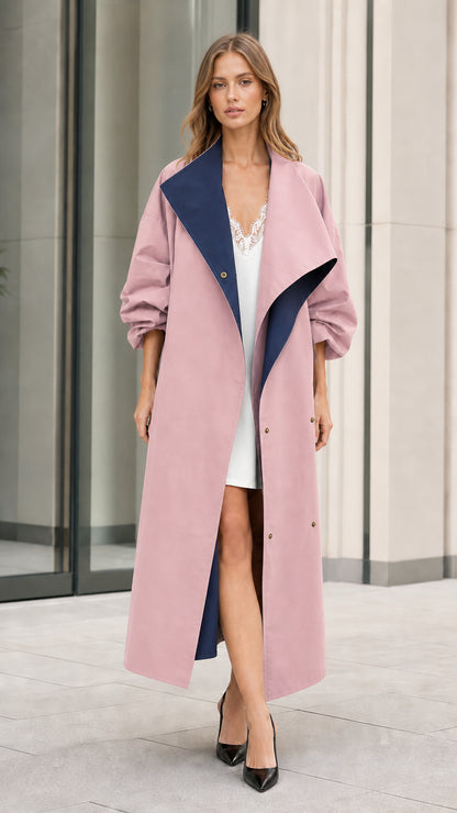 Model in dusty pink maxi duster trench coat with navy contrast lapels