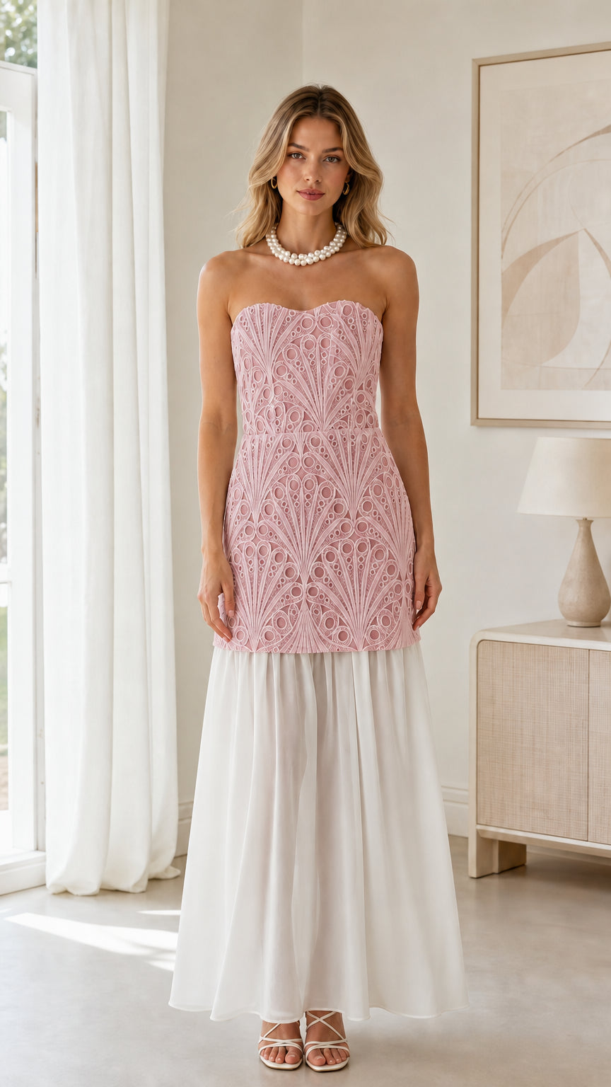 Front view of blush pink embroidered bodice with white skirt strapless maxi dress