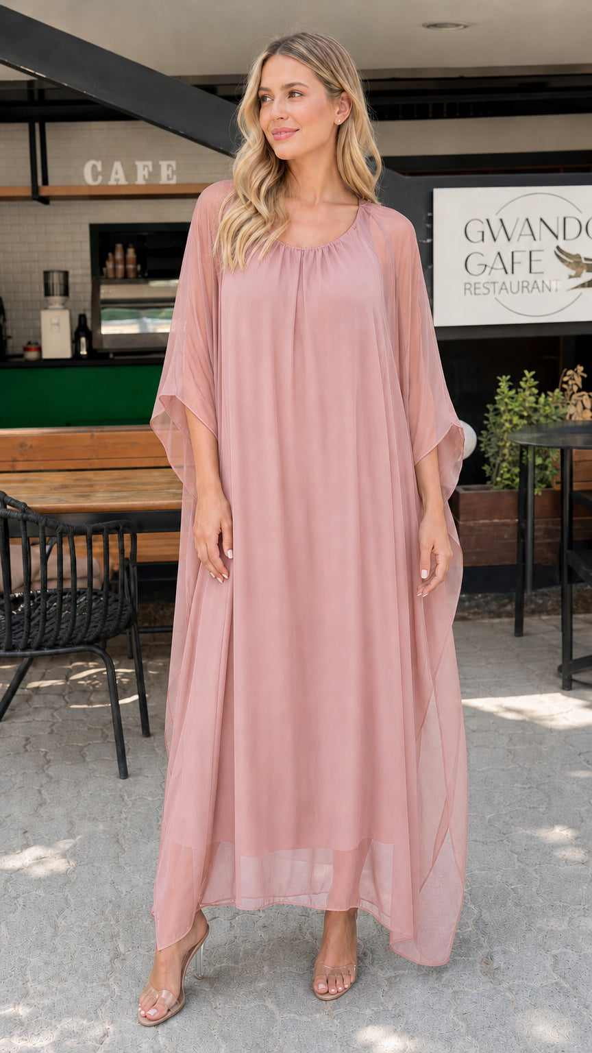 Model wearing dusty rose pink chiffon kaftan maxi dress