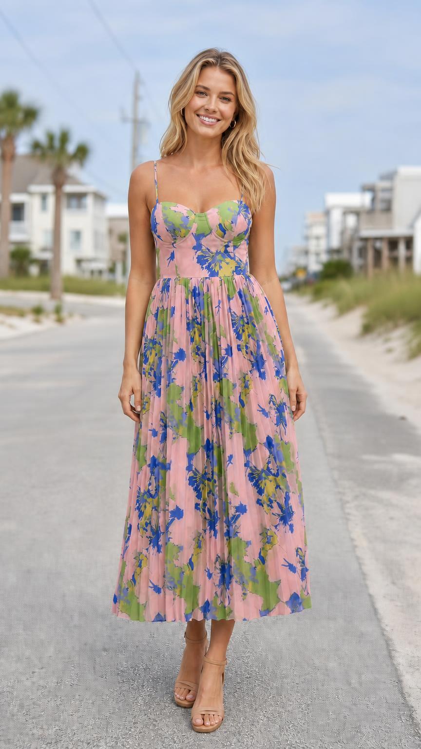 Model wearing pink floral print bustier pleated midi dress