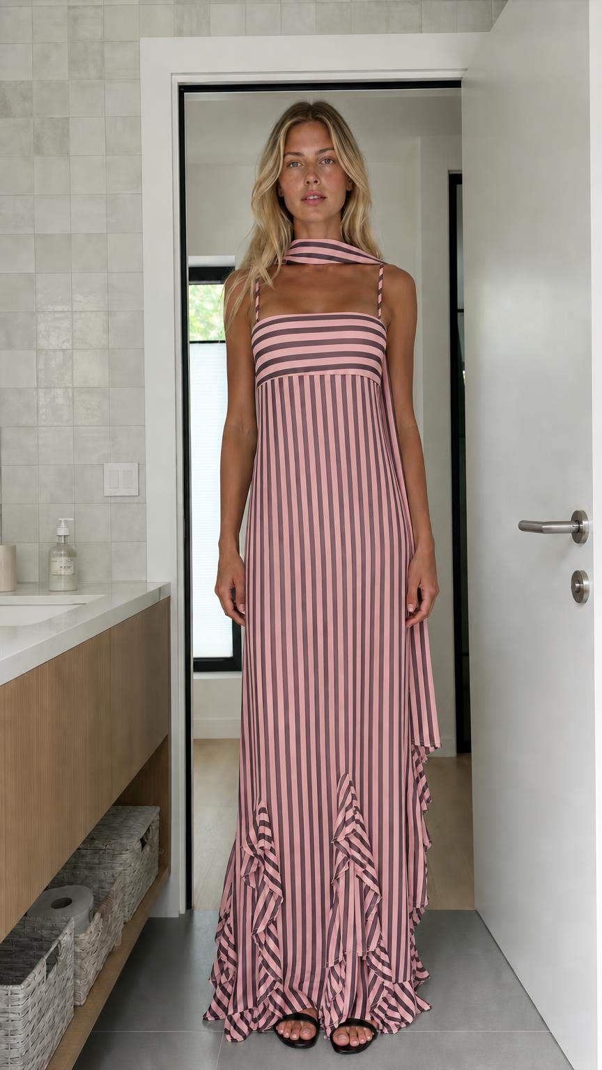 Model wearing pink and white striped maxi dress