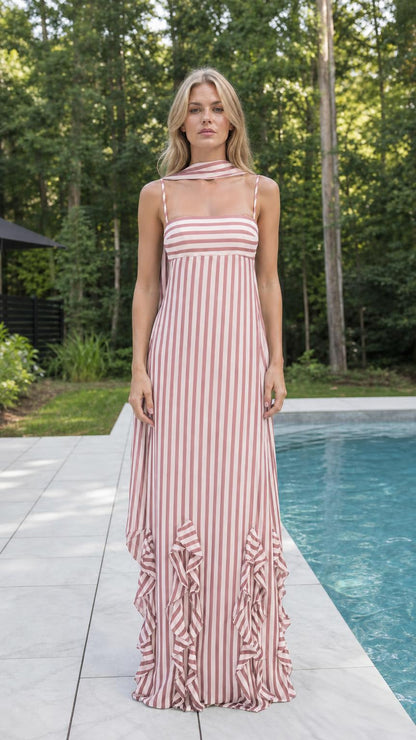 Pink striped maxi dress by a pool