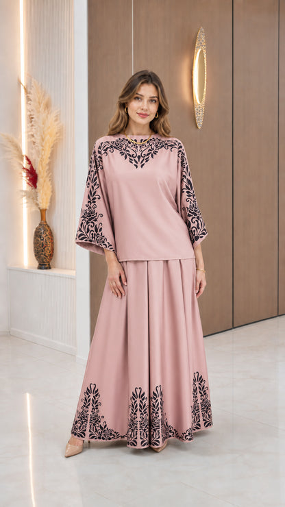 Model wearing Dusty Pink modest blouse and long skirt set with black floral borders