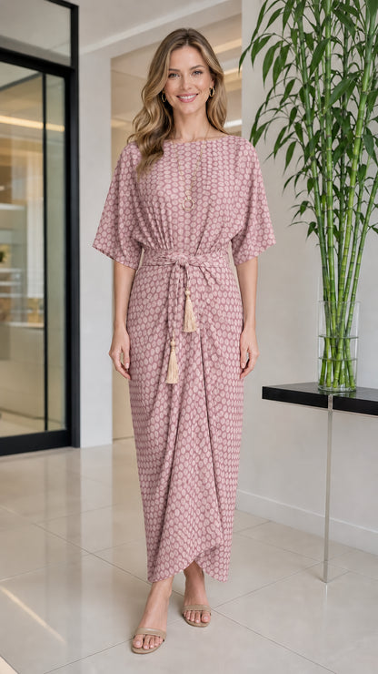 Front view of woman wearing pink geometric print maxi dress