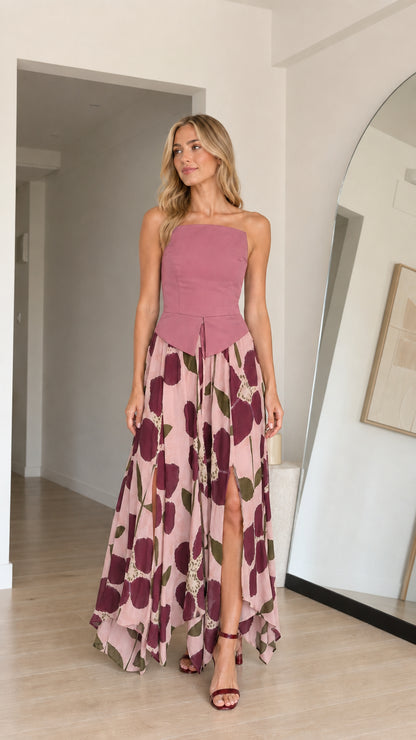 Model wearing pink variant of strapless floral maxi dress