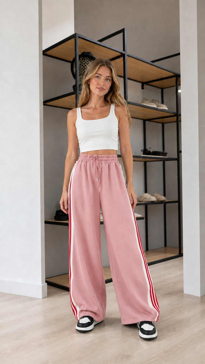 Front view of model wearing Dusty Pink wide leg striped sweatpants