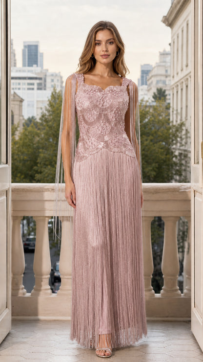 Front view of woman wearing blush pink beaded fringe maxi evening gown