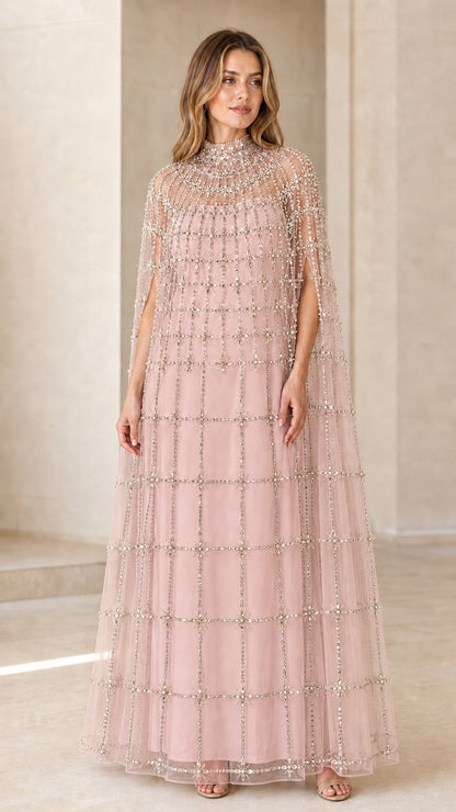 Front view of model wearing Blush Pink crystal beaded cape evening dress