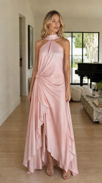 Model wearing solid pink halter maxi dress