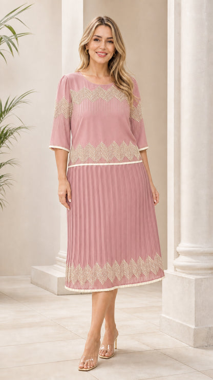 Dusty rose pink geometric pleated midi dress shown from the front