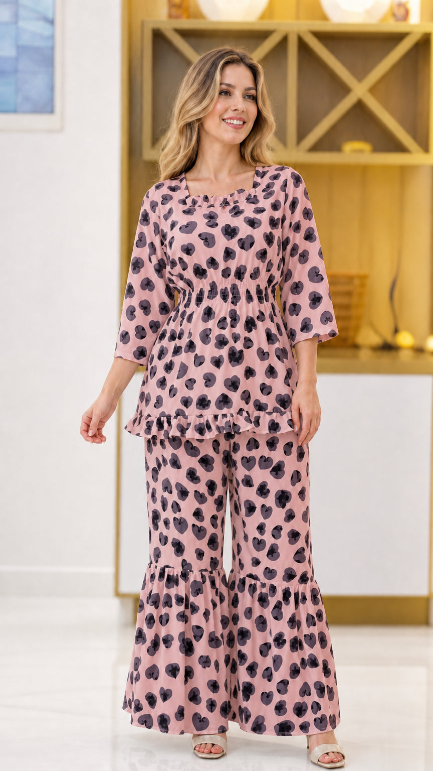 Dusty pink floral print matching 2-piece pant set on model