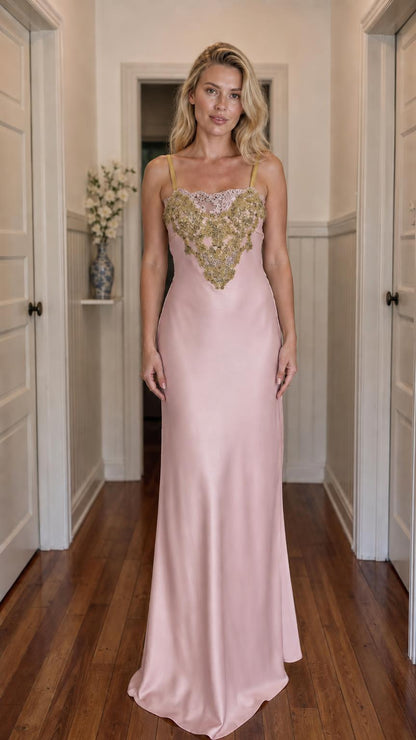 Front view of model wearing dusty pink satin maxi slip dress