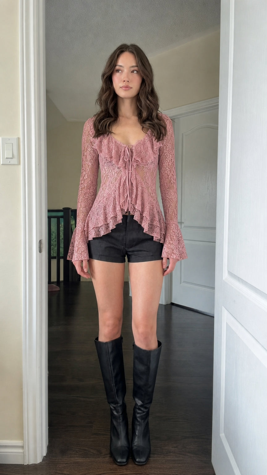 Model wearing Pink sheer lace ruffle tie-front blouse