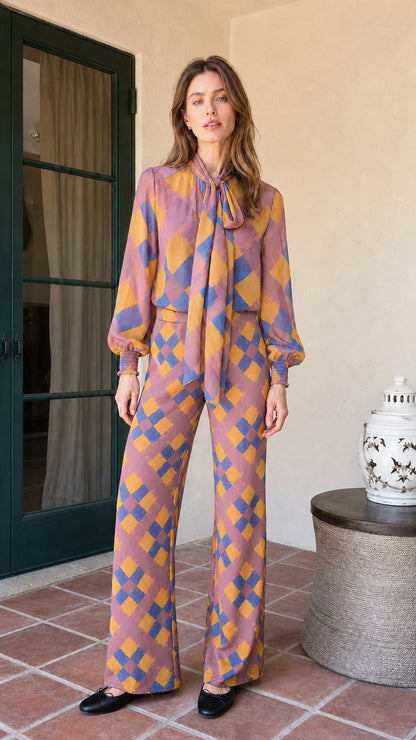 Model wearing mauve colorway of the plaid matching set