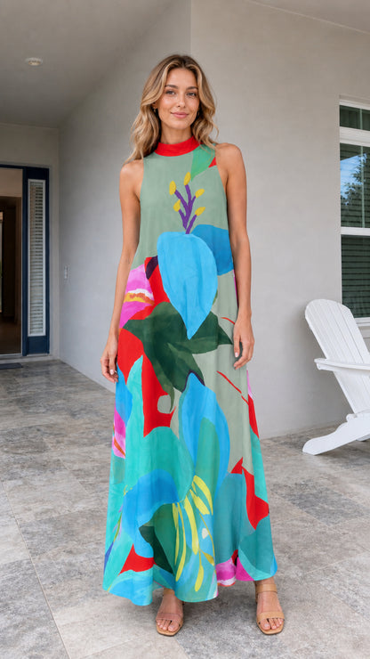 Model wearing green tropical print maxi dress