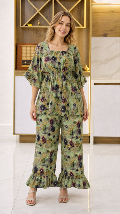 Front view of woman wearing Sage Green floral smocked top and pant set