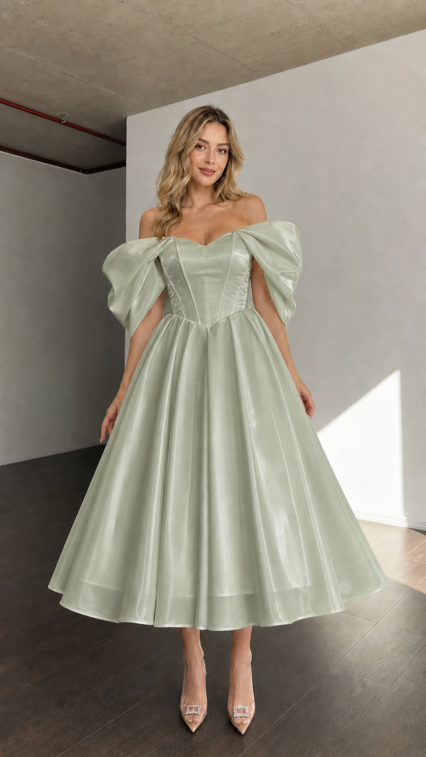 Front view of woman wearing sage green off-shoulder corset midi dress
