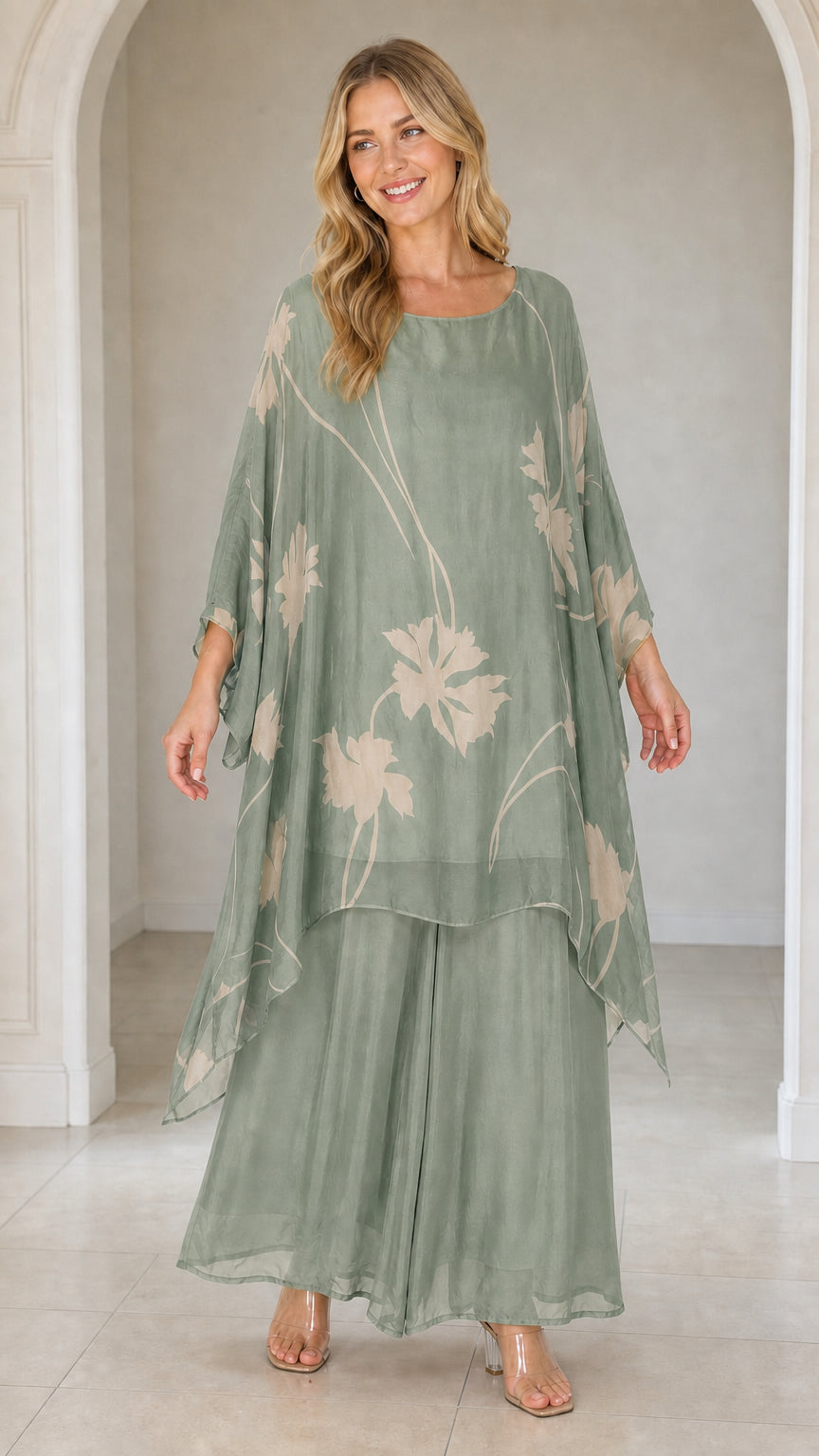 Front view of woman wearing sage green floral kaftan set