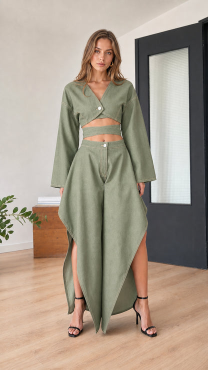 Model wearing sage green two-piece crop top and skirt set