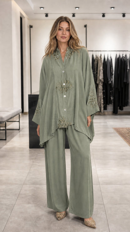 Model wearing sage green embroidered lounge set