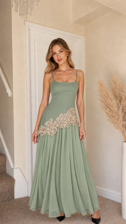 Front view of woman wearing sage green and beige contrast long slip dress