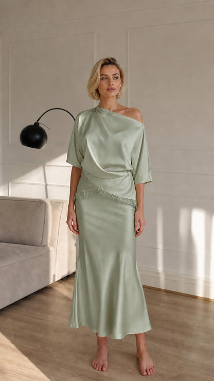 Woman wearing sage green satin two-piece set