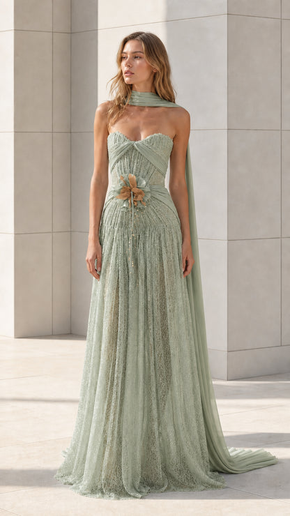 Front view of sage green strapless lace evening gown with draped scarf