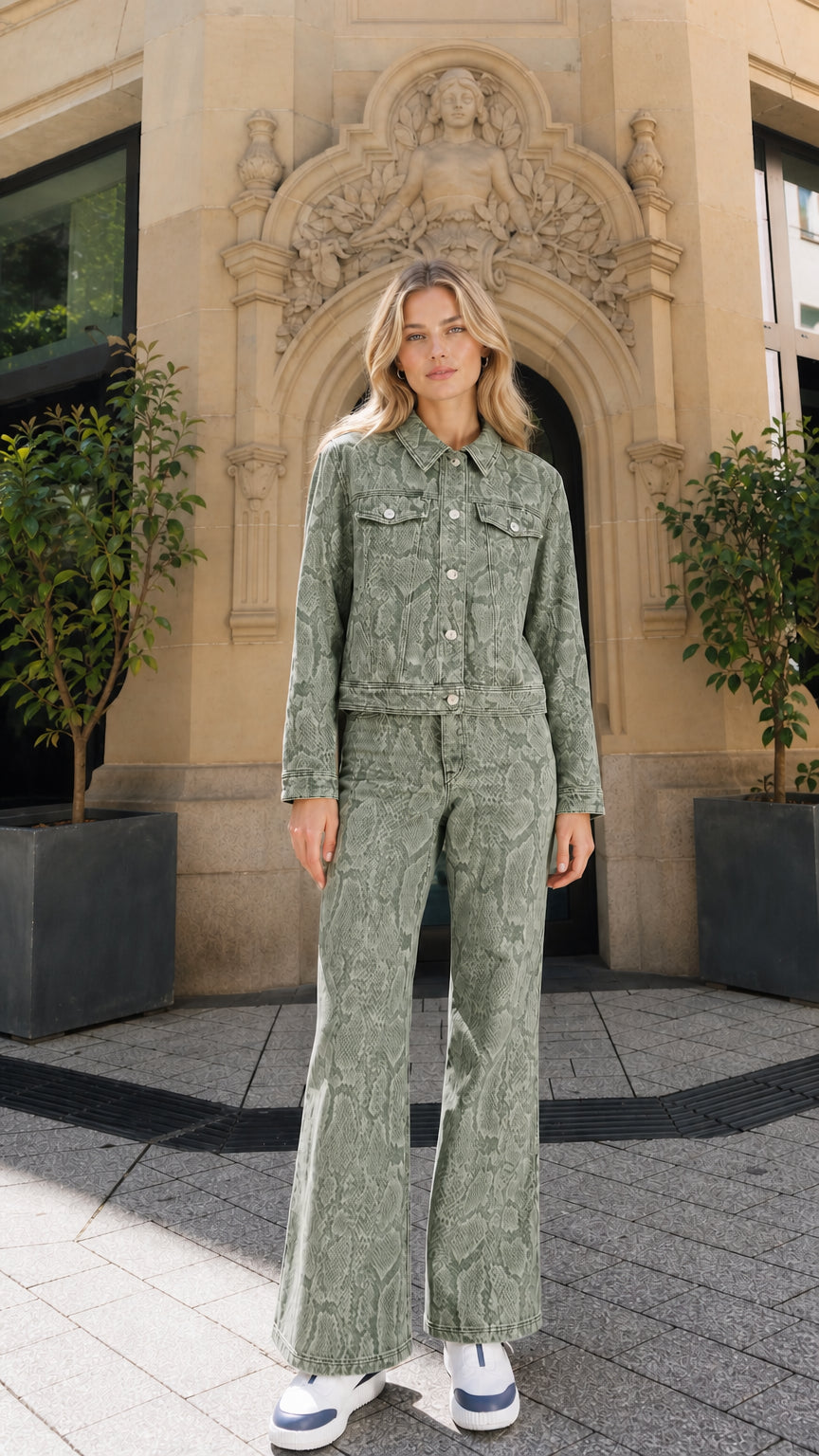 Full view of model wearing green snake print denim matching set
