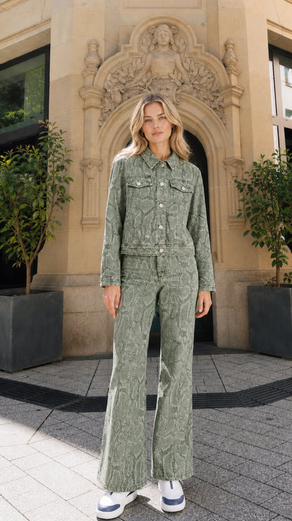 Full view of model wearing green snake print denim matching set