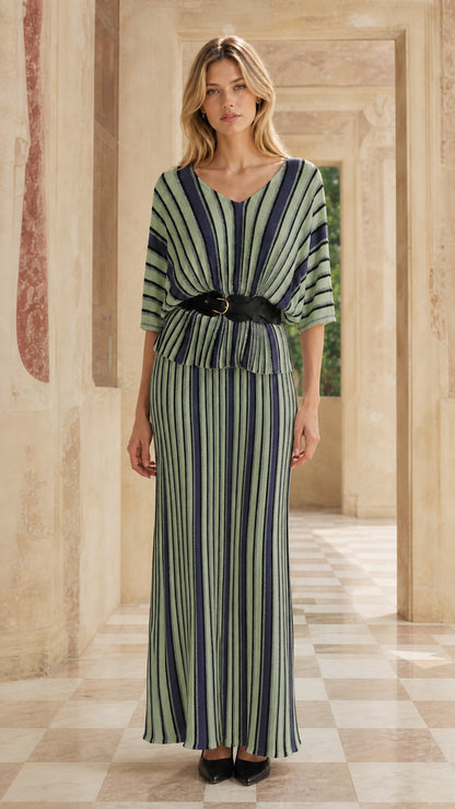 Woman wearing green striped two-piece maxi dress set