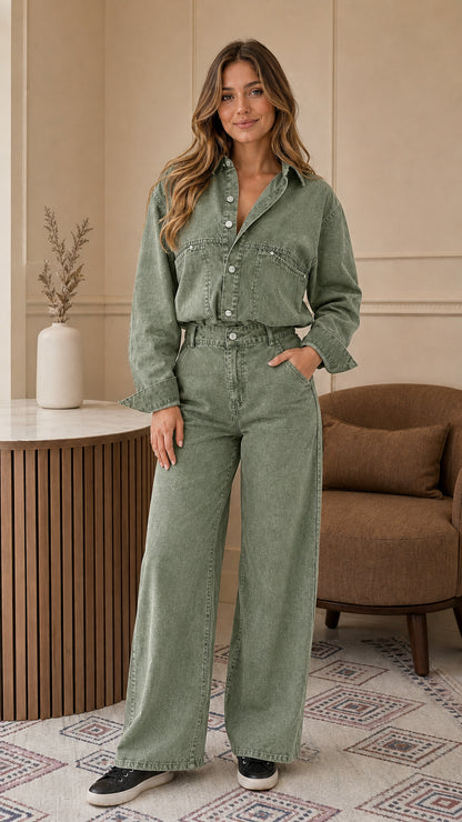 Front view of woman wearing sage green button-down denim utility jumpsuit
