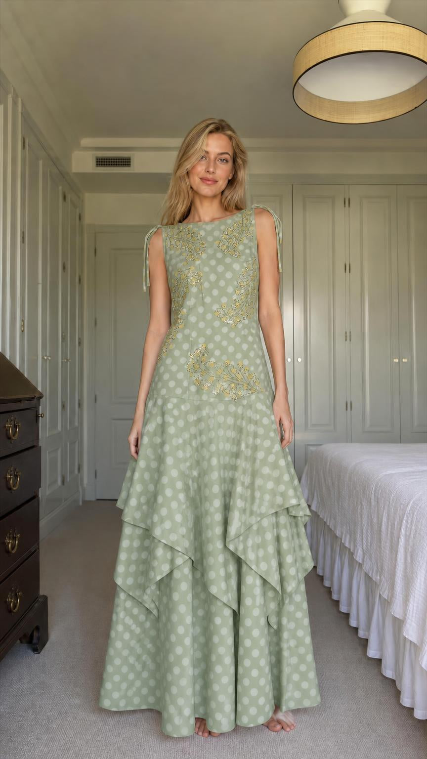 Model wearing sage green polka dot tiered maxi dress