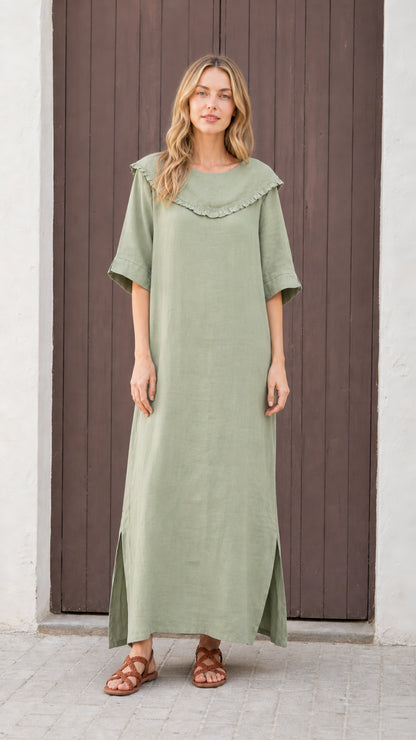 Front view of woman wearing sage green relaxed-fit maxi dress