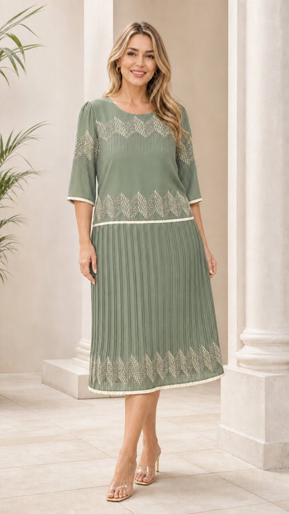 Sage green geometric pleated midi dress shown from the front