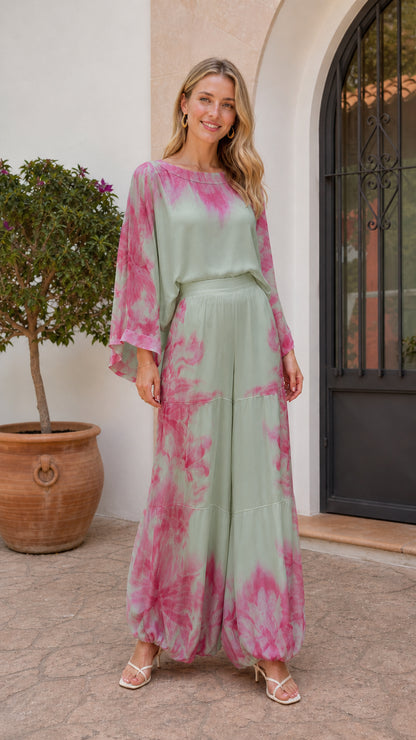 Model wearing sage green and pink tie-dye two-piece set