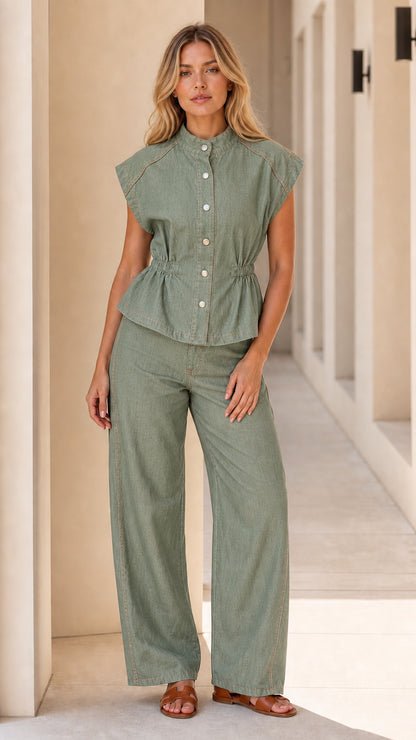 Model wearing sage green denim matching set