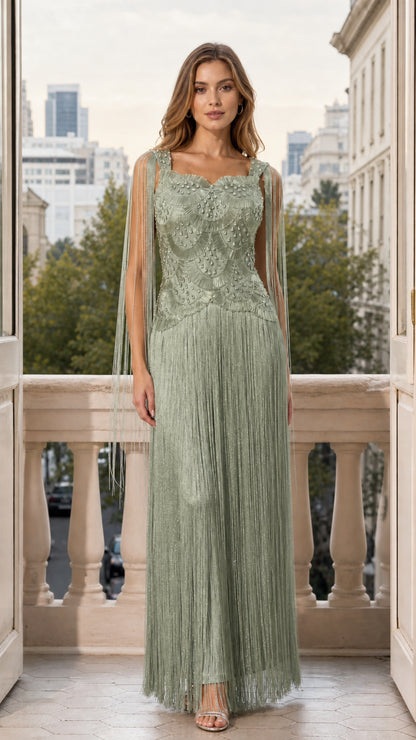 Front view of woman wearing sage green beaded fringe maxi evening gown