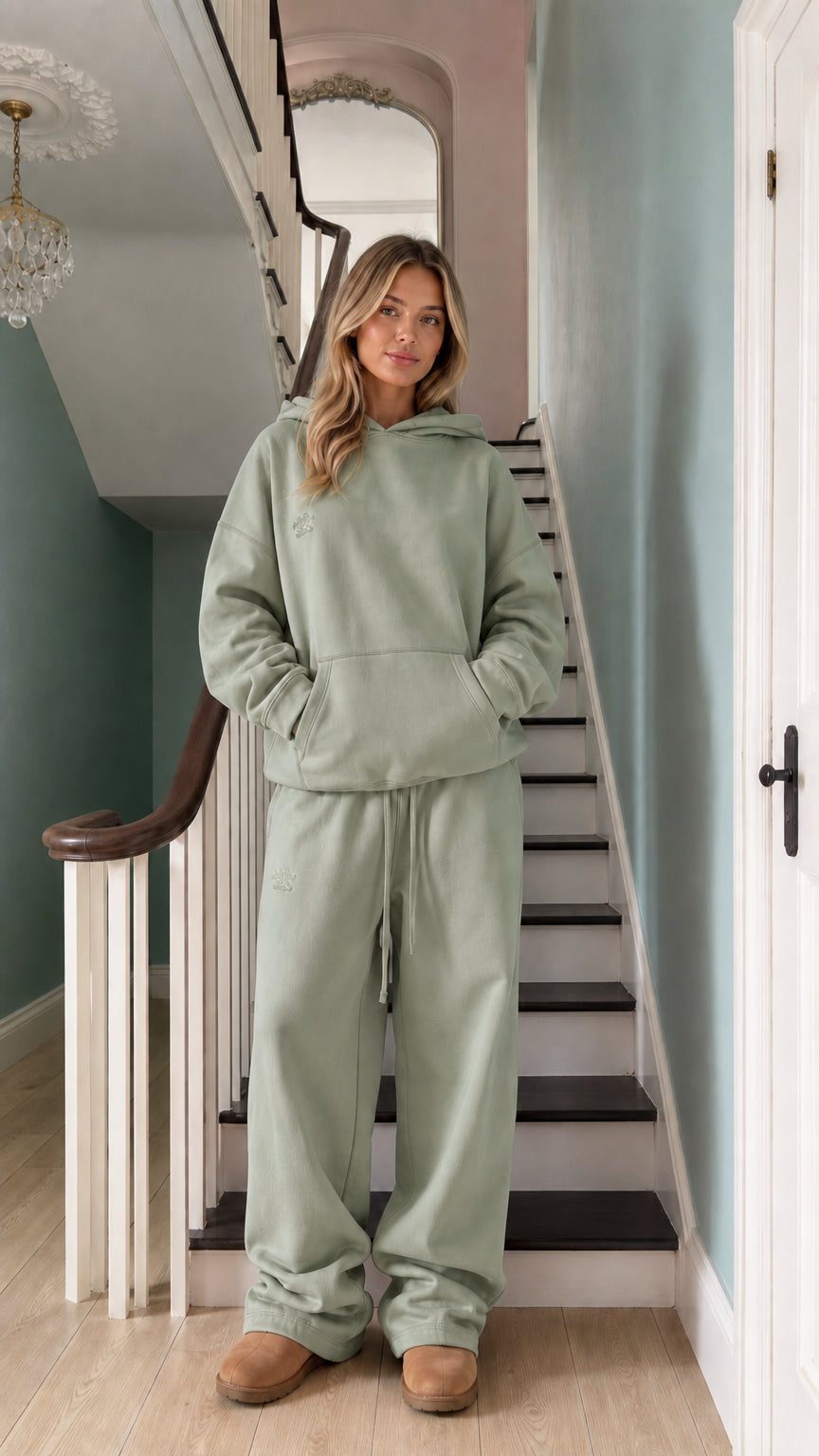 Women's sage green pullover hoodie and matching wide-leg lounge pants